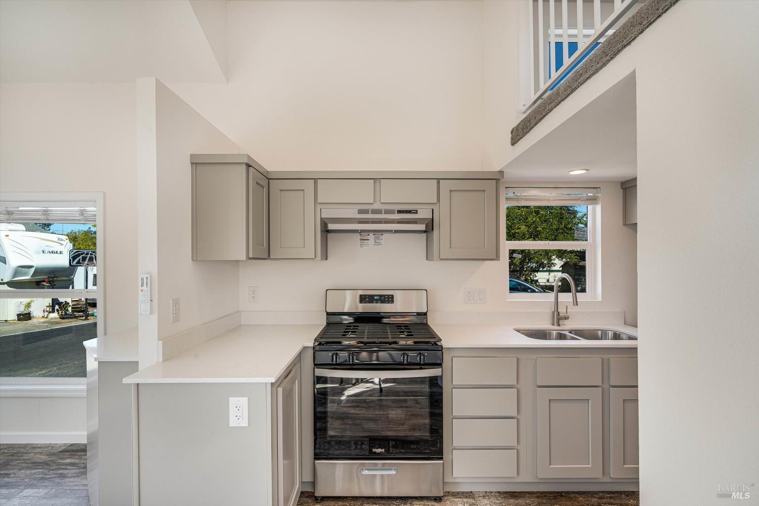 101 Colgan Avenue, Unit 2 Santa Rosa, CA 95404 - Photo 14 of 32 a kitchen with white cabinets and appliances