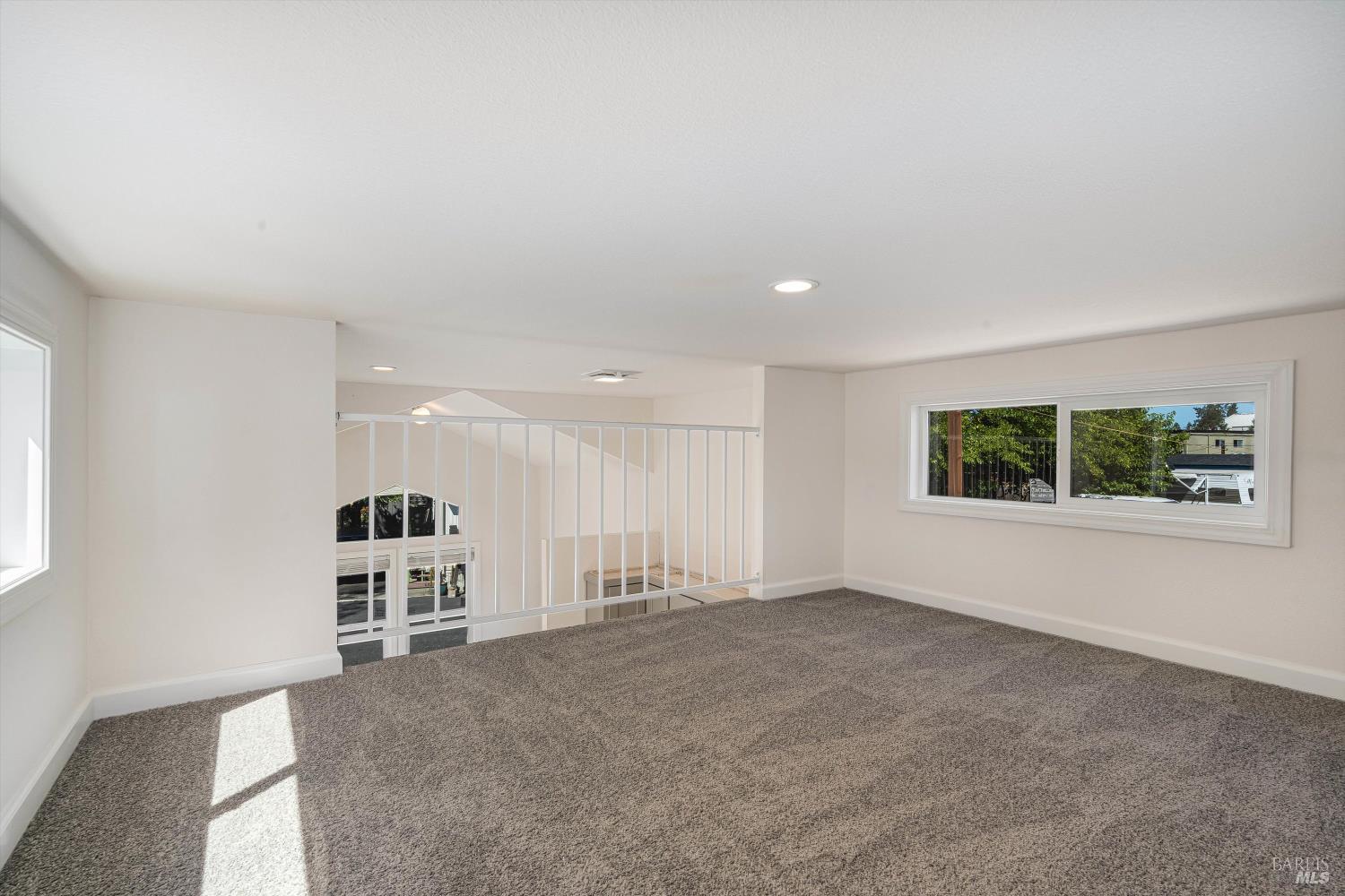 101 Colgan Avenue, Unit 2 Santa Rosa, CA 95404 - Photo 25 of 32 an empty room with windows and entrance