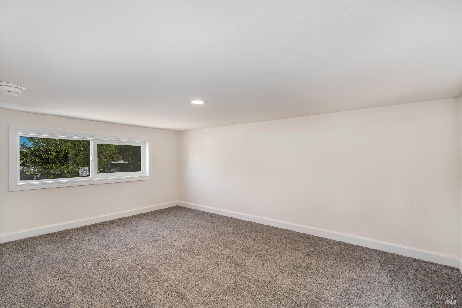 101 Colgan Avenue, Unit 2 Santa Rosa, CA 95404 - Photo 26 of 32 an empty room with a window
