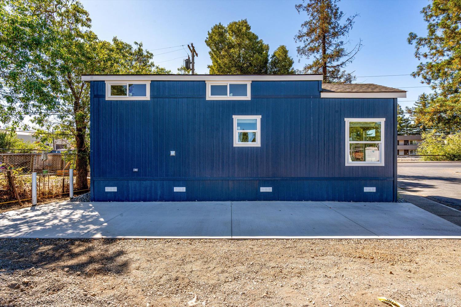 101 Colgan Avenue, Unit 2 Santa Rosa, CA 95404 - Photo 27 of 32 a view of a house with a large tree and wooden fence
