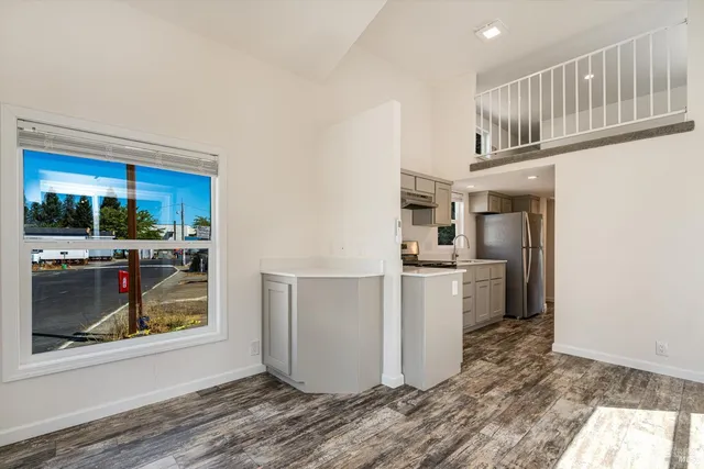 a kitchen with a refrigerator and cabinets