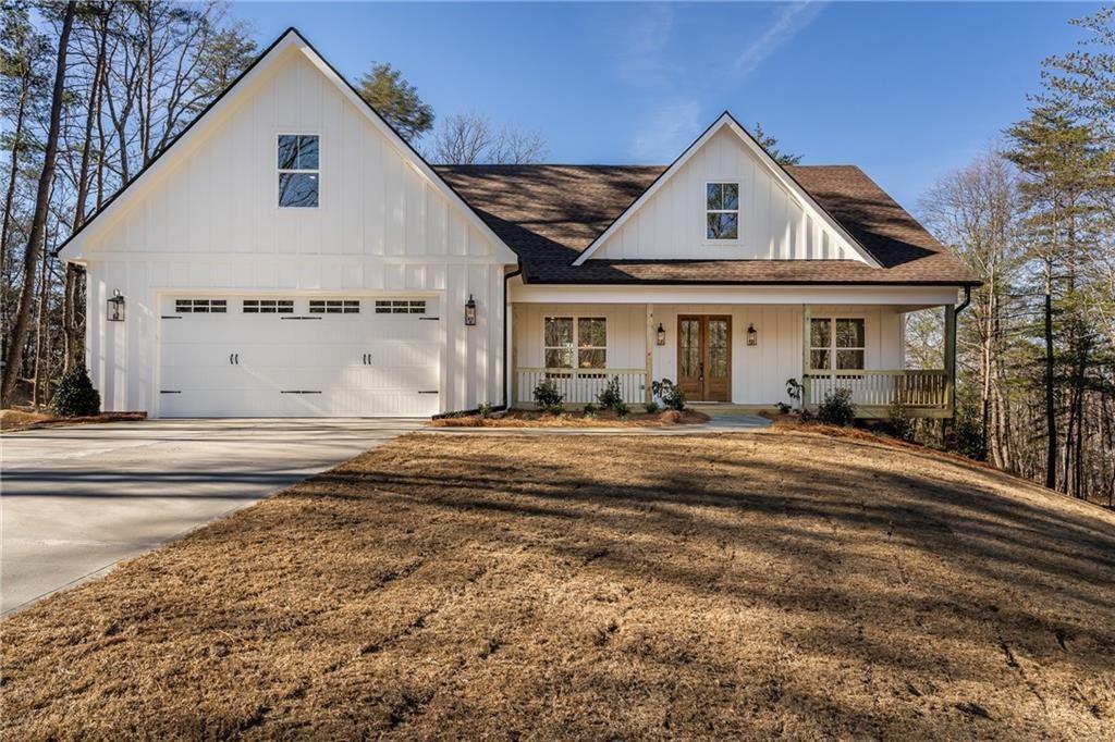 5 Lowe Lane Jasper, GA 30143 - Photo 1 of 16 a front view of a house with a yard