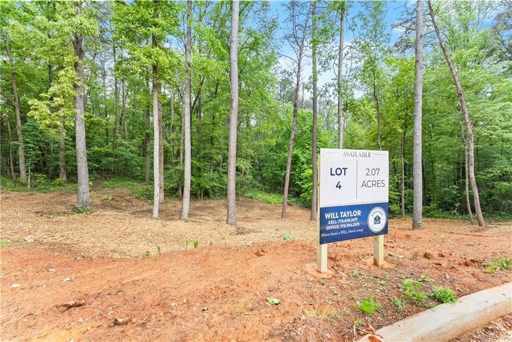 5 Lowe Lane Jasper, GA 30143 - Photo 12 of 16 a sign board with tall trees