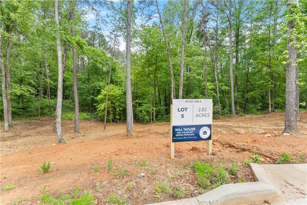 5 Lowe Lane Jasper, GA 30143 - Photo 13 of 16 a sign board with tree in the background