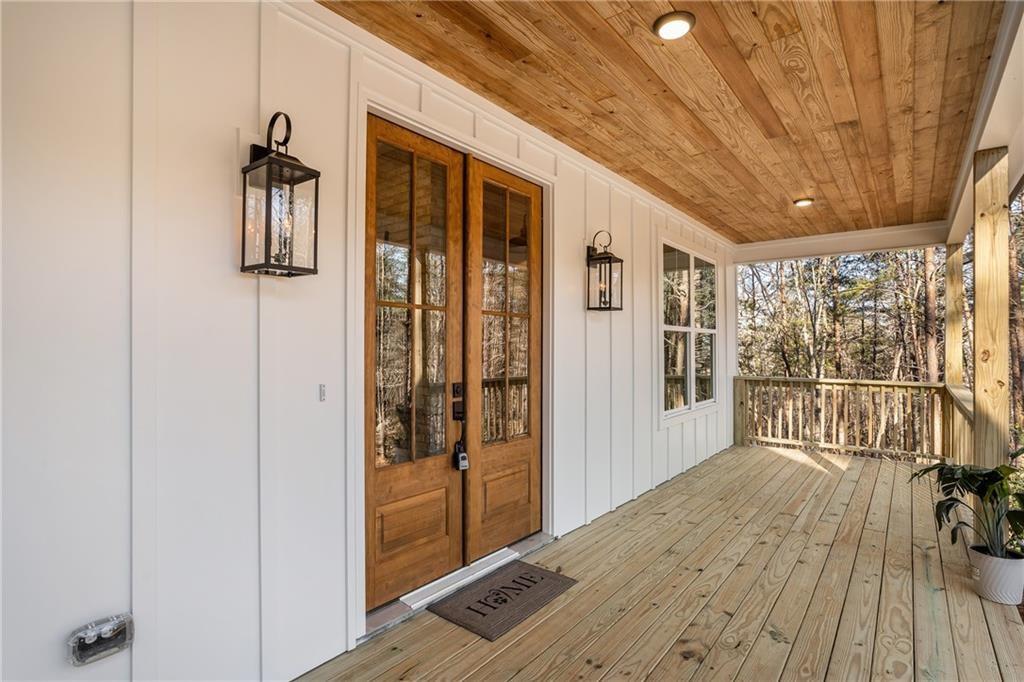 5 Lowe Lane Jasper, GA 30143 - Photo 2 of 16 a hallway with wooden floor and windows
