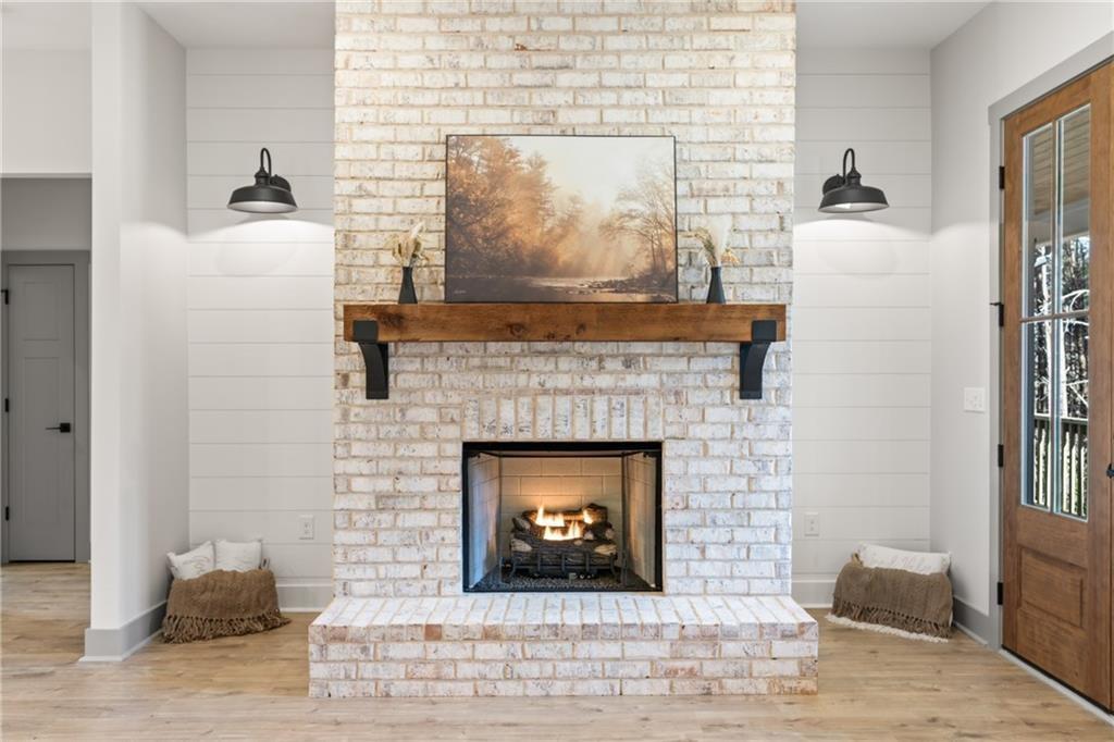 5 Lowe Lane Jasper, GA 30143 - Photo 3 of 16 a living room with a fireplace and a wooden floor