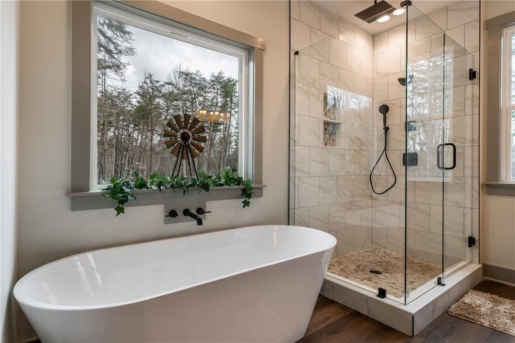 5 Lowe Lane Jasper, GA 30143 - Photo 8 of 16 a white bath tub sitting next to a shower