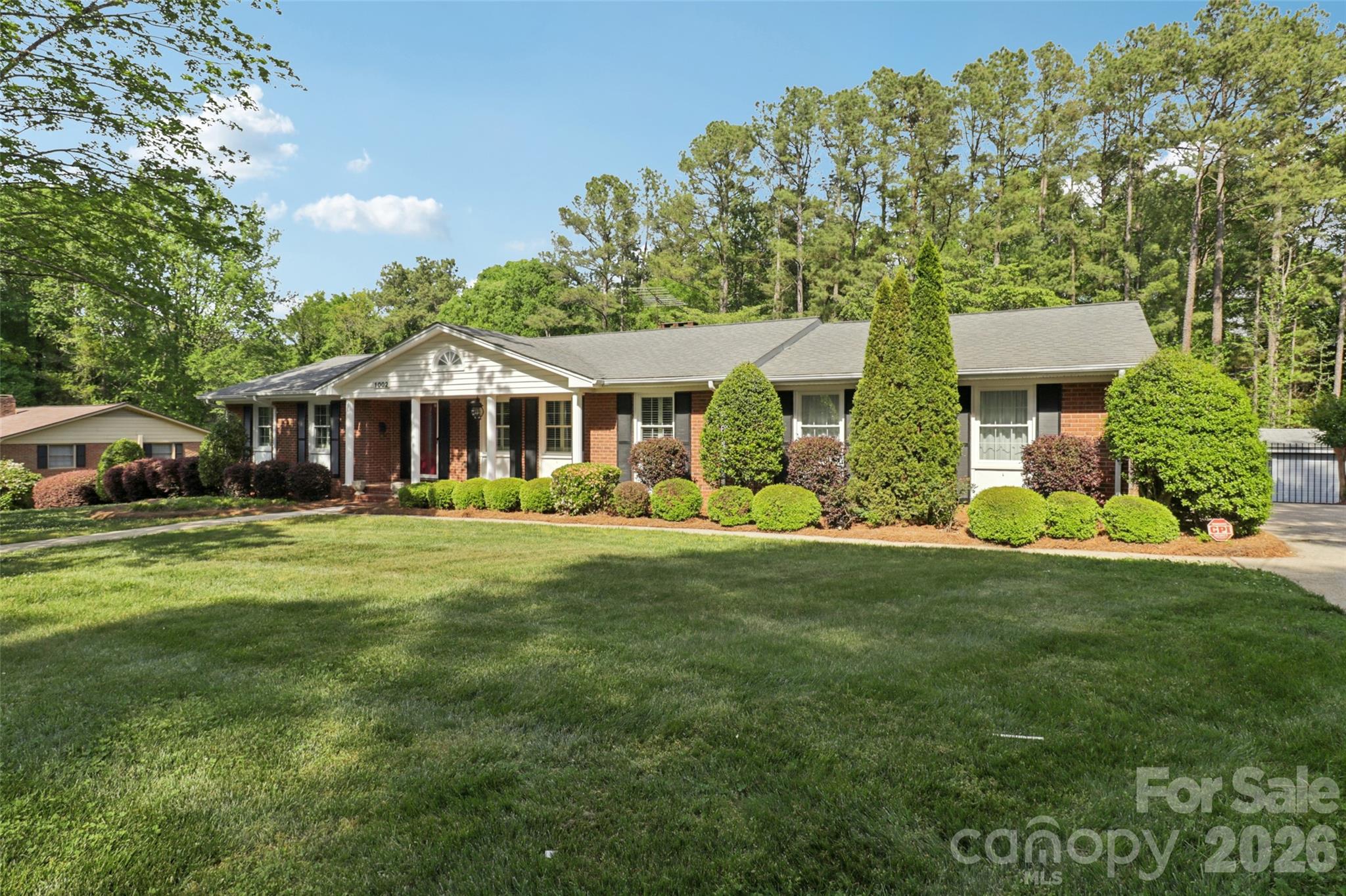 1002 Ridge Street Albemarle, NC 28001 - Photo 2 of 45 a front view of a house with a garden