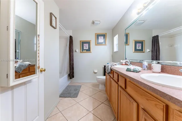 a bathroom with a sink a mirror and a shower