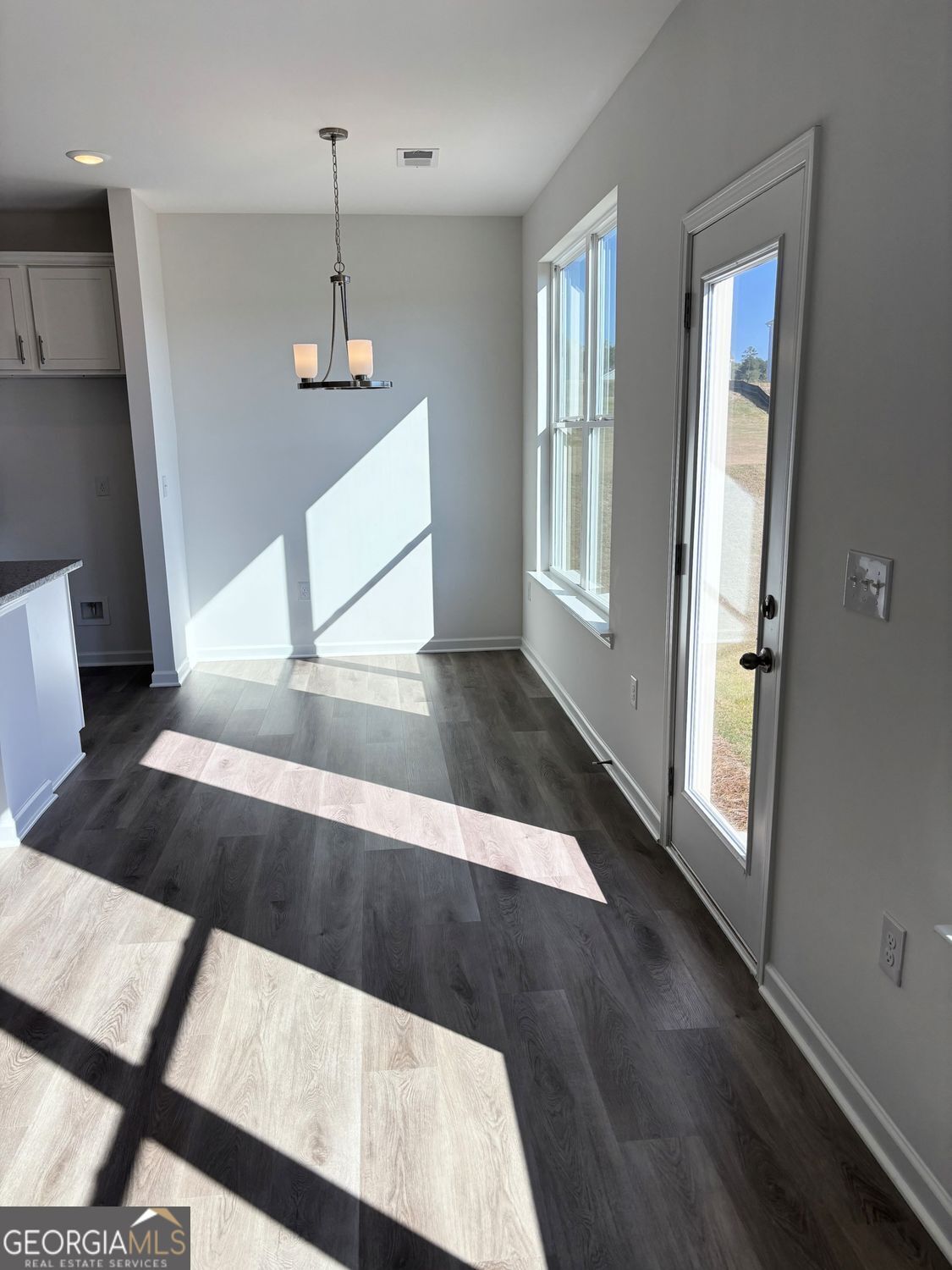 5984 Spring Way Lithonia, GA 30038 - Photo 7 of 17 a view of a living room with wooden floor and stairs