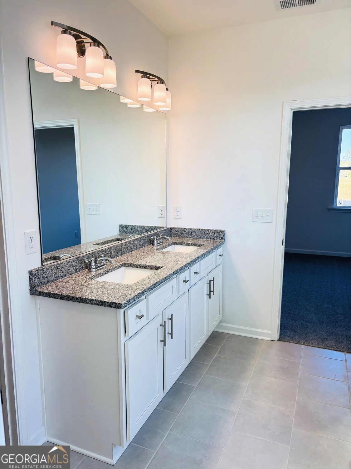 5984 Spring Way Lithonia, GA 30038 - Photo 9 of 17 a bathroom with a granite countertop sink and a mirror