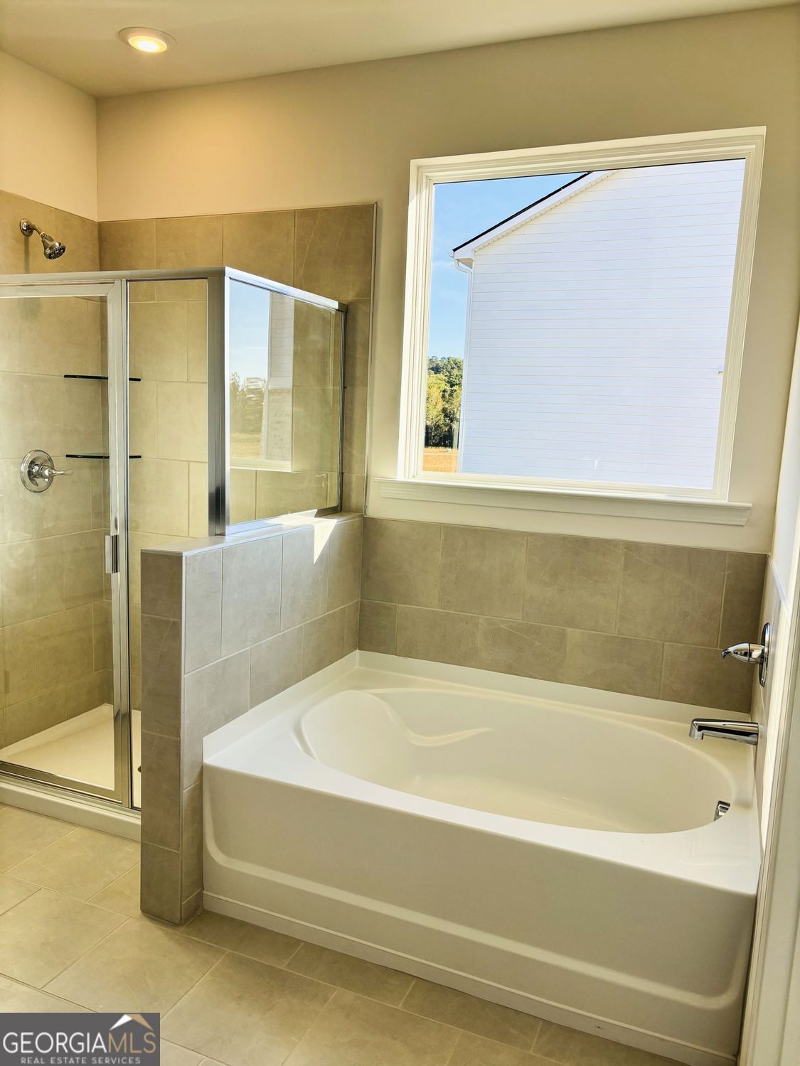 5984 Spring Way Lithonia, GA 30038 - Photo 10 of 17 a bathroom with a bathtub and a shower