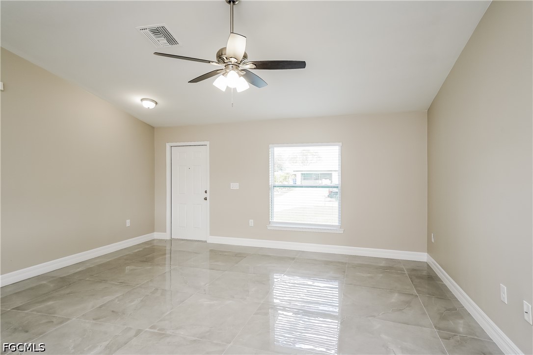 3707 10th Street Southwest Lehigh Acres, FL 33976 - Photo 2 of 15 a view of an empty room with a window