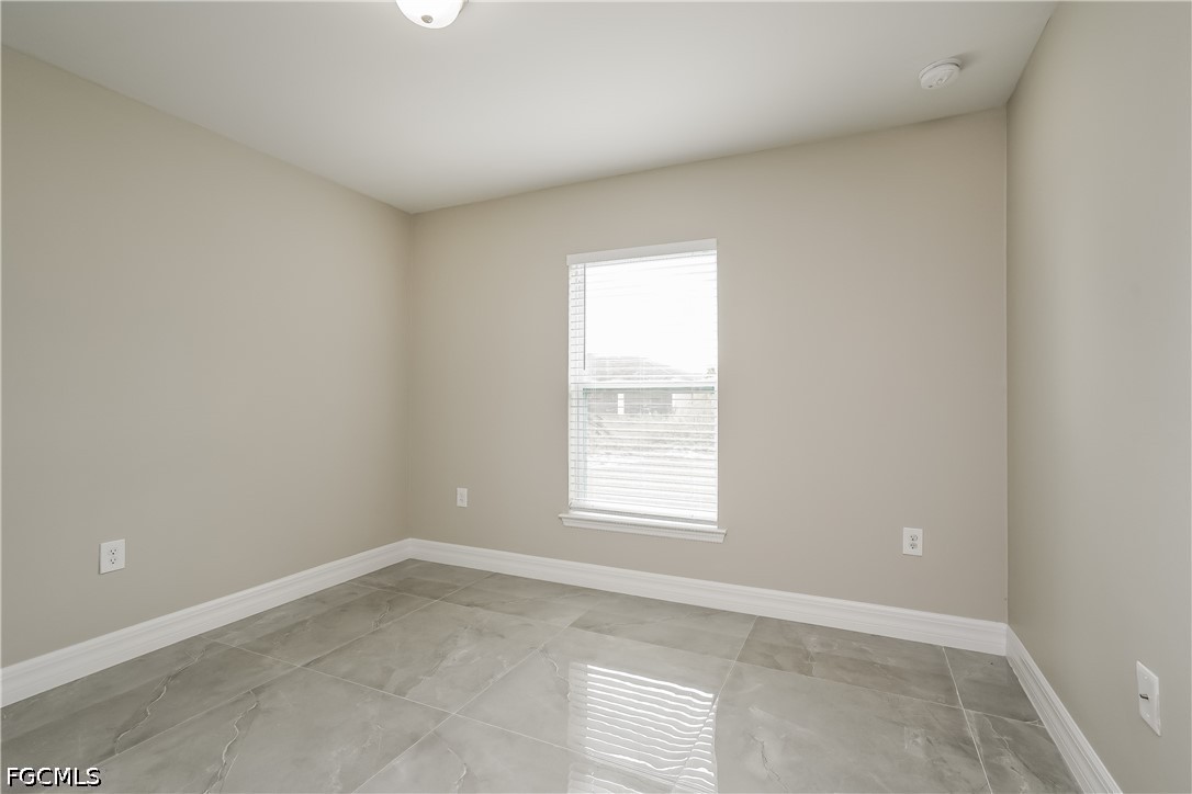 3707 10th Street Southwest Lehigh Acres, FL 33976 - Photo 10 of 15 an empty room with a window