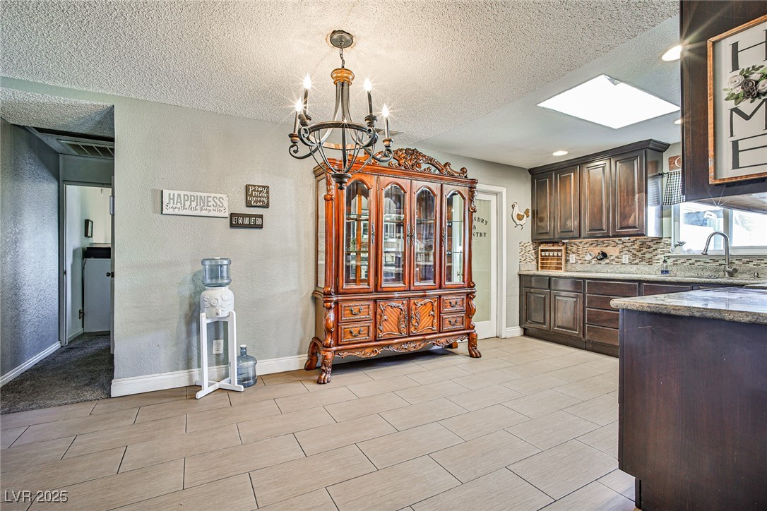 2540 Eagle Street Las Vegas, NV 89142 - Photo 13 of 29 Kitchen featuring tasteful backsplash, an inviting