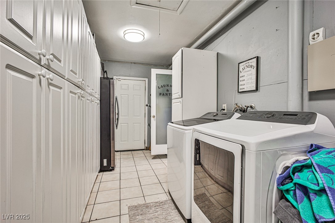 2540 Eagle Street Las Vegas, NV 89142 - Photo 16 of 29 Laundry area featuring attic access, washer and cl