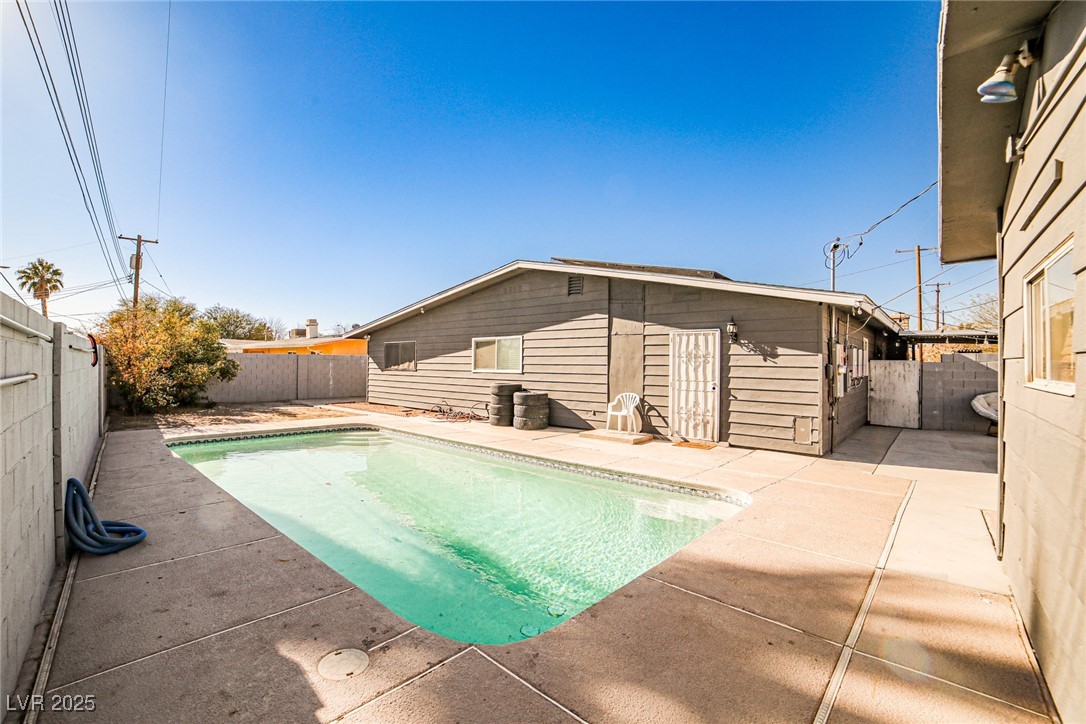 2540 Eagle Street Las Vegas, NV 89142 - Photo 2 of 29 View of pool with a fenced backyard, a patio, and