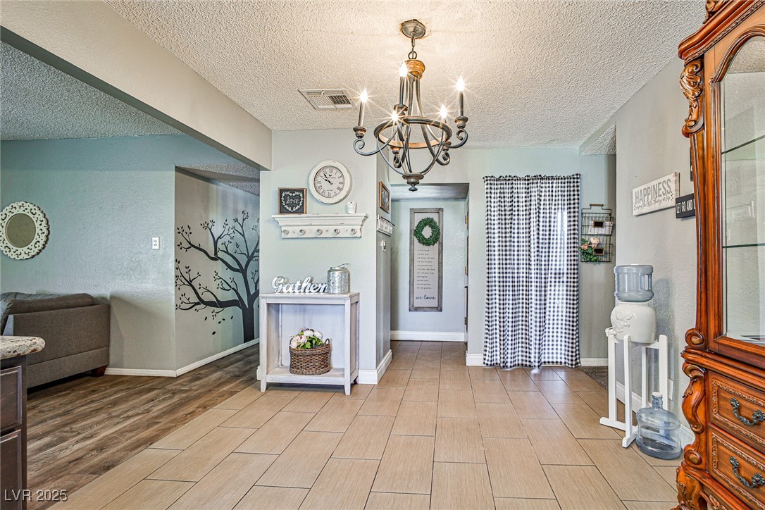 2540 Eagle Street Las Vegas, NV 89142 - Photo 6 of 29 Entryway featuring wood tiled floor, visible vents