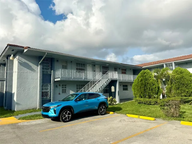 a car parked in front of a house