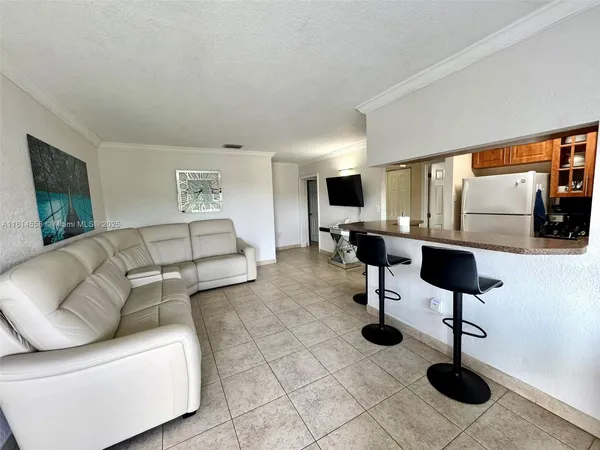 a living room with furniture and a lamp