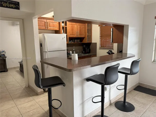 a living room with fireplace furniture and a flat screen tv