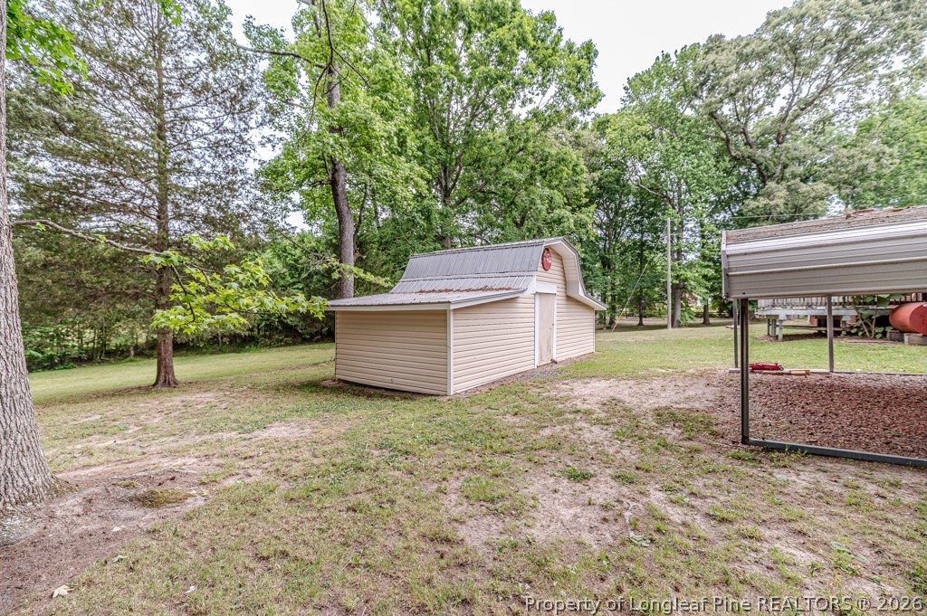 3384 Goldston Glendon Road Goldston, NC 27252 - Photo 45 of 47 a view of a house with a back yard
