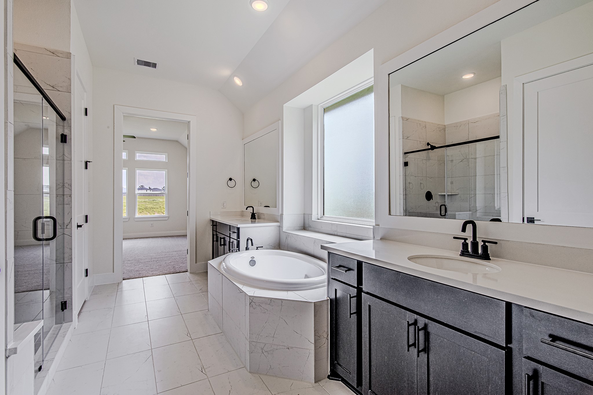 157 Peninsula Point Drive Montgomery, TX 77356 - Photo 19 of 33 a bathroom with a sink and a mirror