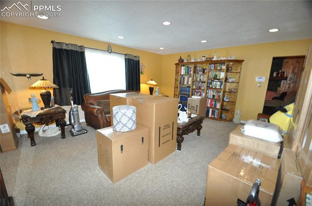 36825 East Jones Road Yoder, CO 80864 - Photo 13 of 35 Very spacious living room located left of the front door. Please excuse boxes, packing in progress :)