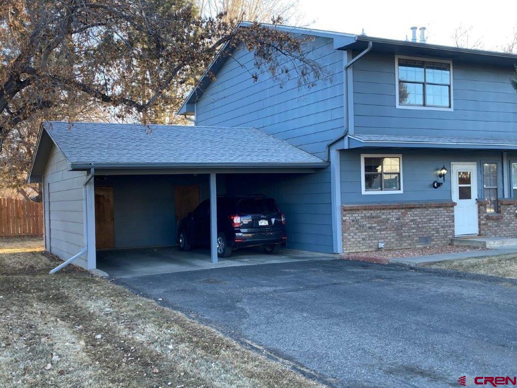 2721 Patterson Road, Unit 404 Grand Junction, CO 81506 - Photo 2 of 26 front view of a house with a yard