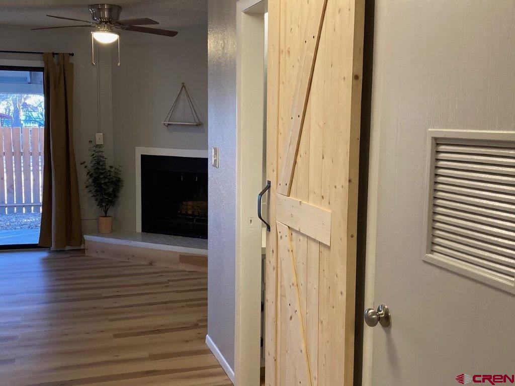 2721 Patterson Road, Unit 404 Grand Junction, CO 81506 - Photo 4 of 26 a view of a hallway with wooden floor and staircase