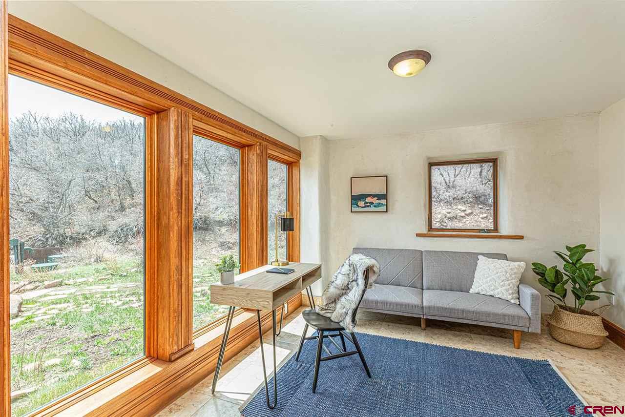 2529 County Road 124 Mancos, CO 81328 - Photo 16 of 34 a living room with furniture and a large window