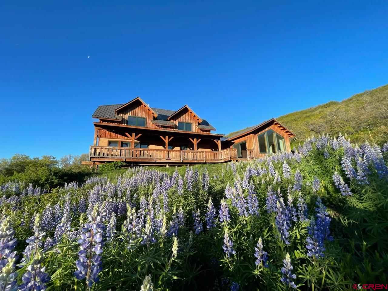 2529 County Road 124 Mancos, CO 81328 - Photo 3 of 34 a front view of a house with a yard