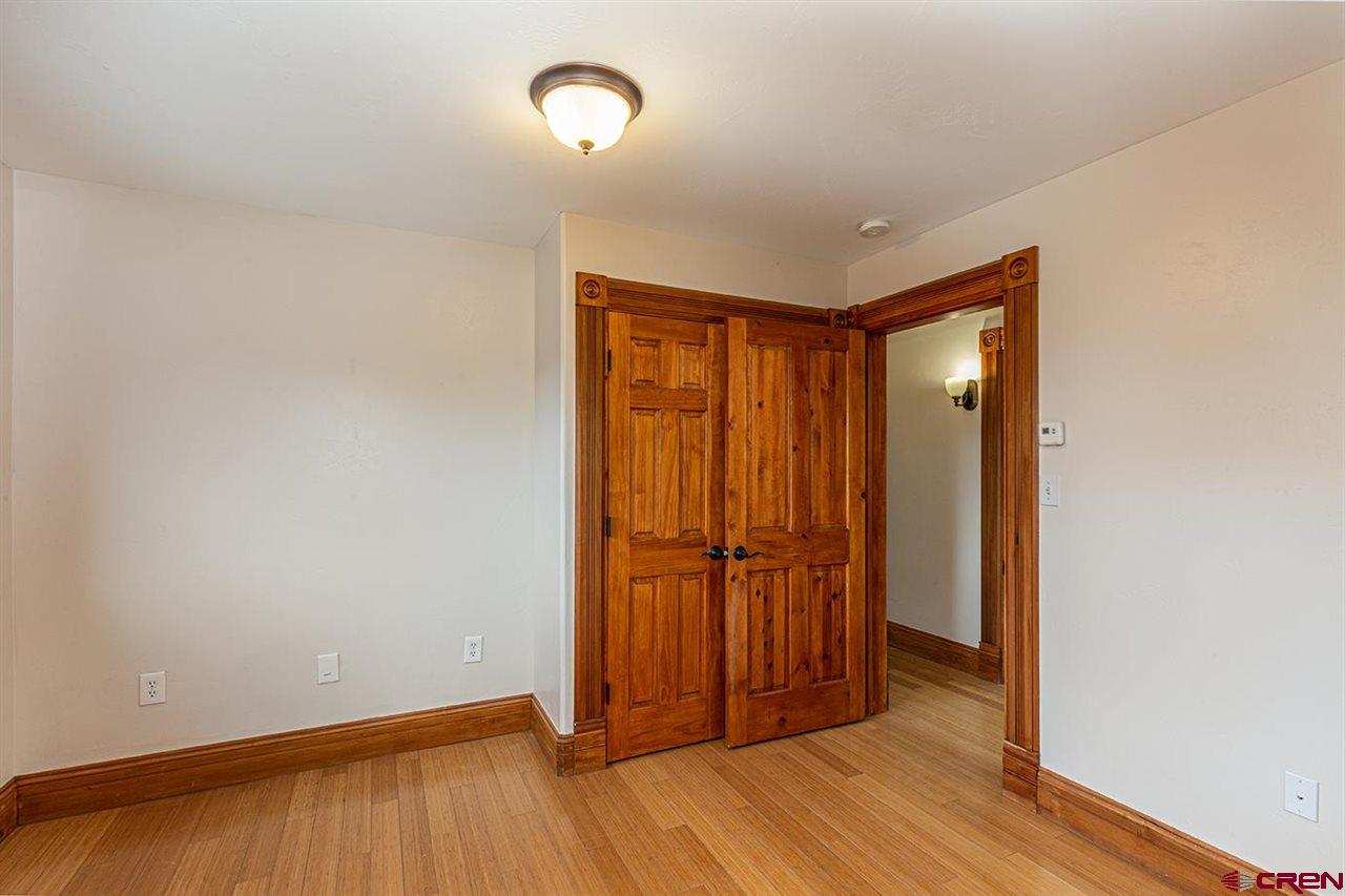 2529 County Road 124 Mancos, CO 81328 - Photo 22 of 34 an empty room with wooden floor