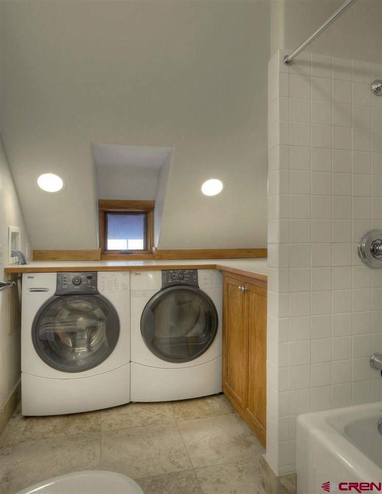 2529 County Road 124 Mancos, CO 81328 - Photo 24 of 34 a utility room with a washer and dryer
