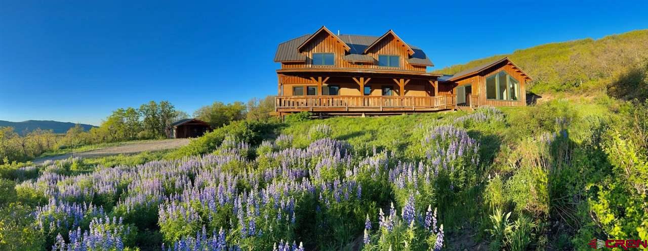 2529 County Road 124 Mancos, CO 81328 - Photo 30 of 34 a front view of a house with balcony