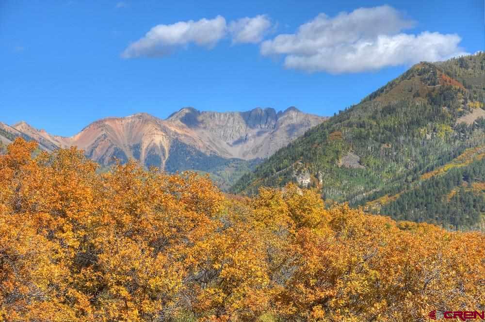 2529 County Road 124 Mancos, CO 81328 - Photo 32 of 34 a view of a dry yard with mountains in the background