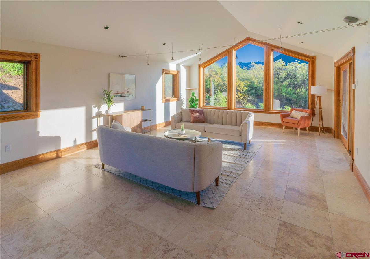 2529 County Road 124 Mancos, CO 81328 - Photo 8 of 34 a living room with furniture and a large window