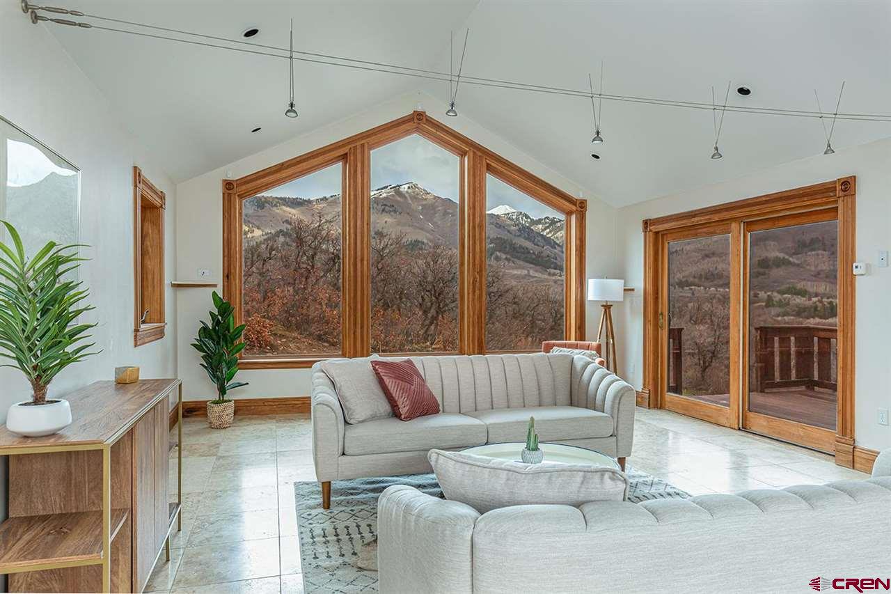 2529 County Road 124 Mancos, CO 81328 - Photo 9 of 34 a living room with furniture and a large window