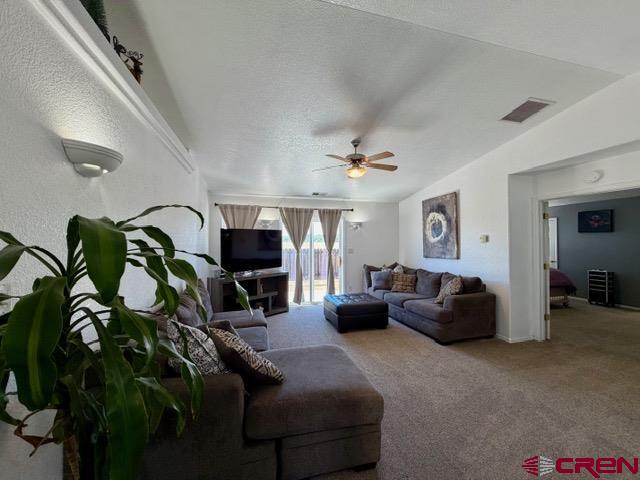 544 20th Street Delta, CO 81416 - Photo 14 of 44 a living room with furniture and a flat screen tv