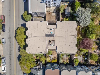 an aerial view of a house with outdoor space