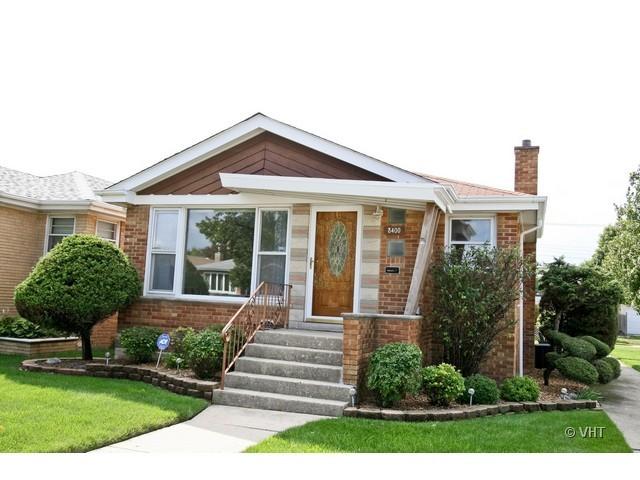 8400 South Kenneth Avenue Chicago, IL 60652 - Photo 1 of 16 a front view of a house with garden