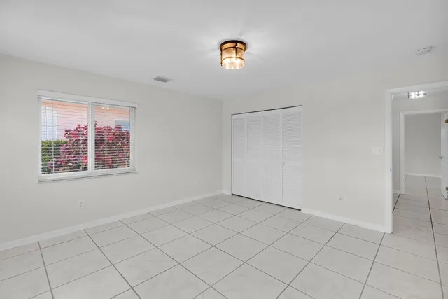 a bathroom with a granite countertop sink a toilet and a bathtub