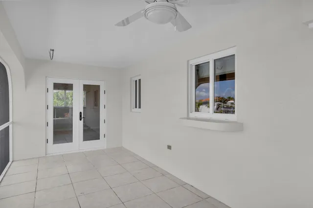 a view of a porch with a floor to ceiling windows with wooden floor