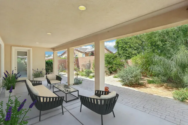 a view of an empty room with glass door