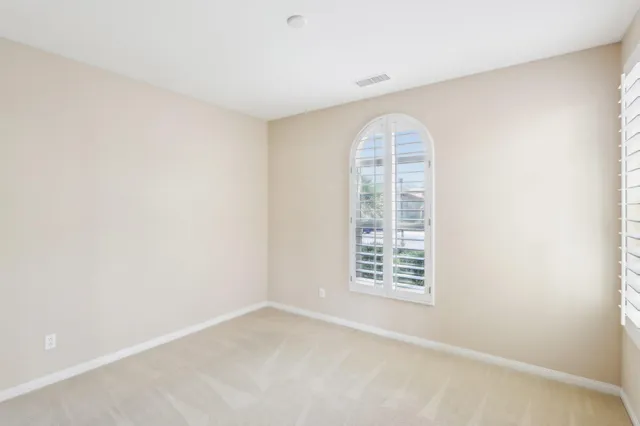 a kitchen with a sink and large window