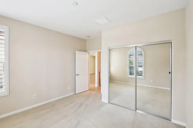 an aerial view of residential houses with outdoor space and lake view