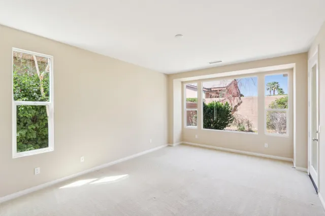 an aerial view of residential houses with outdoor space and swimming pool