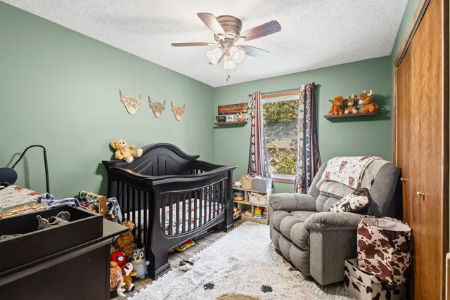 a bedroom with furniture and a window