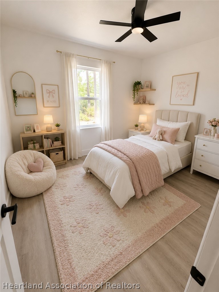 4307 Talbot Street Sebring, FL 33872 - Photo 14 of 19 a bedroom with a bed a mirror and a window