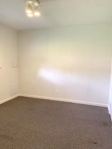 a bathroom with a bathtub and a window